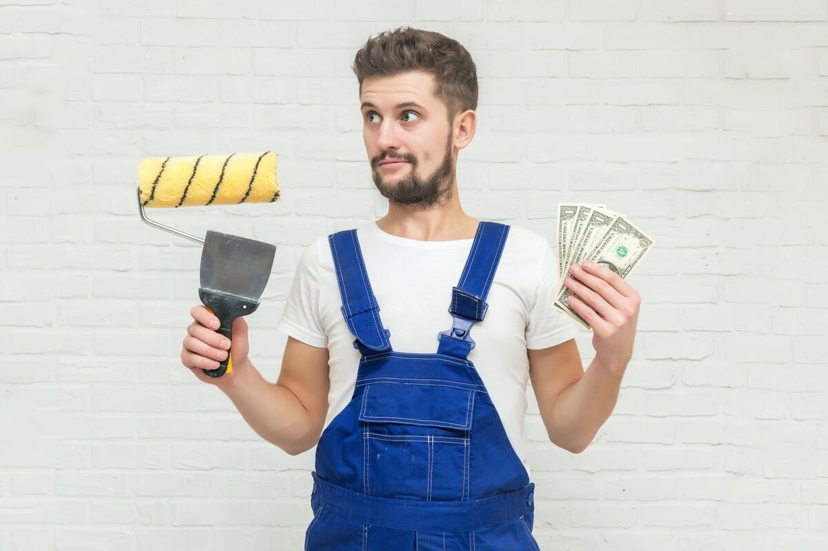 Painter holding equipment and money