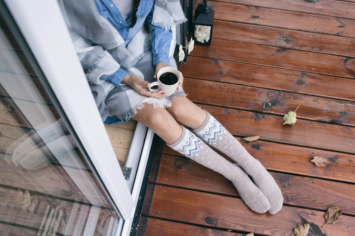 Woman on her deck in the winter