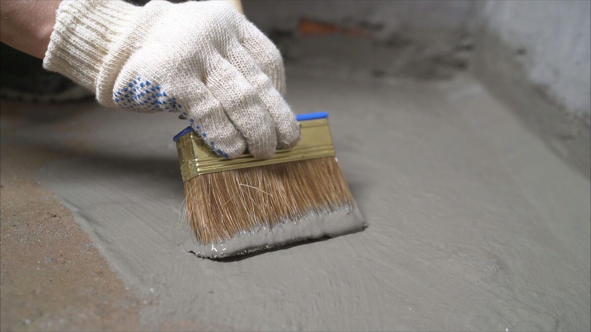 Man painting a basement floor