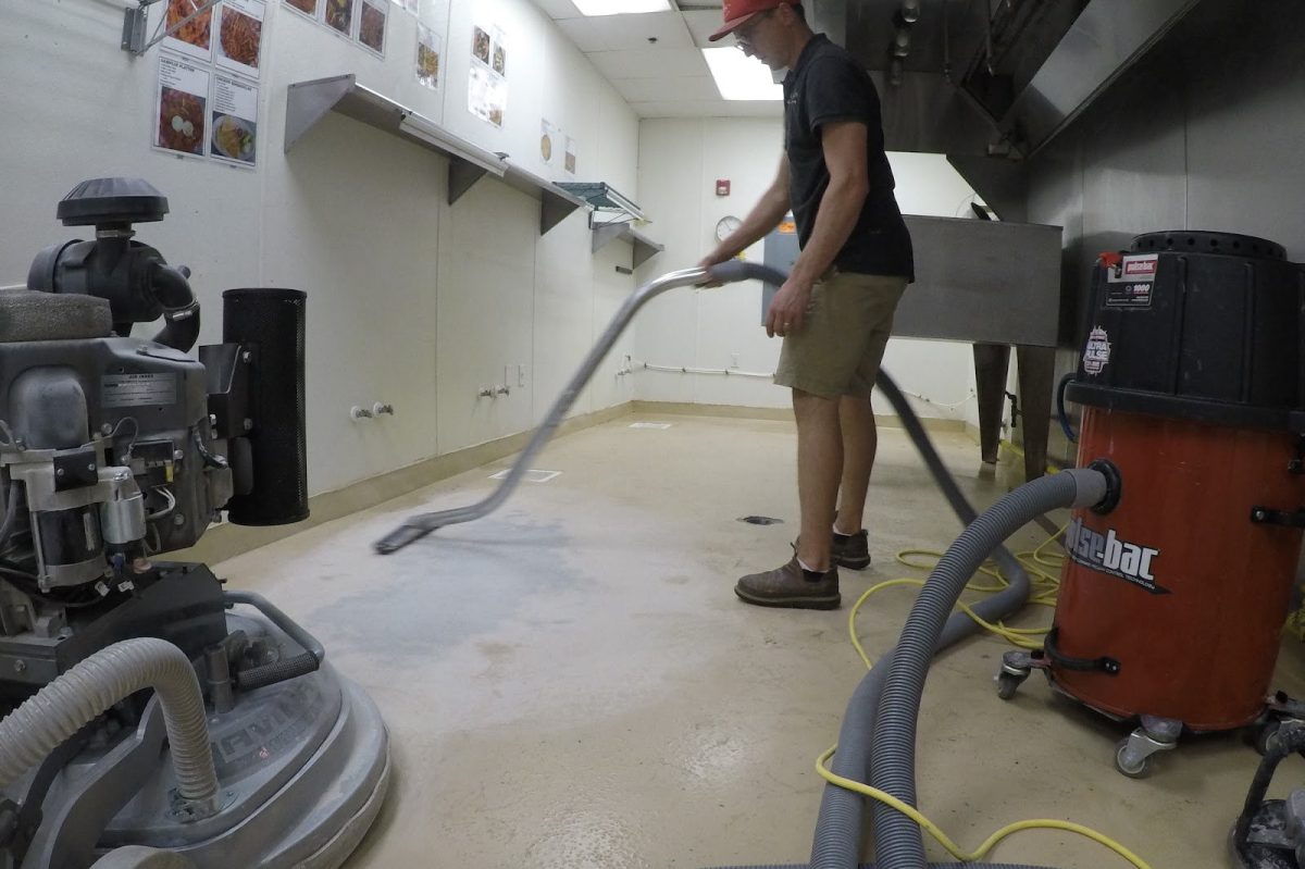 Man cleaning a floor.